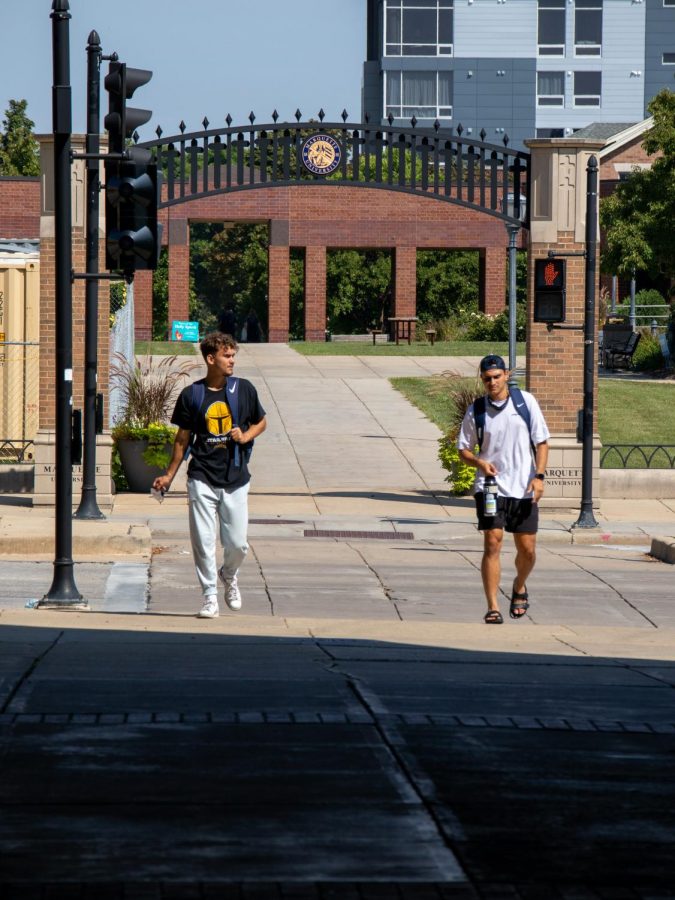 Students walking outside of Alumni Memorial Union. 