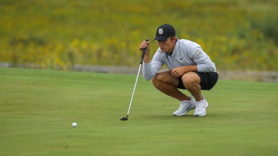 First-year golfer Max Lyons lines up his putt. (Photo courtesy of Marquette Athletics.) 