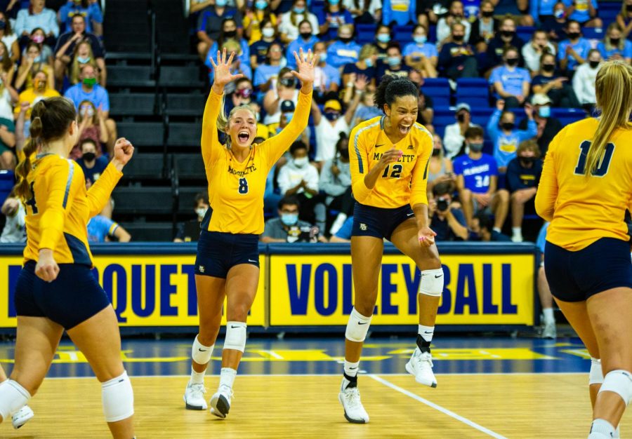 Marquette volleyball celebrates during its 0-3 loss to No. 8 Kentucky Sept. 11. 