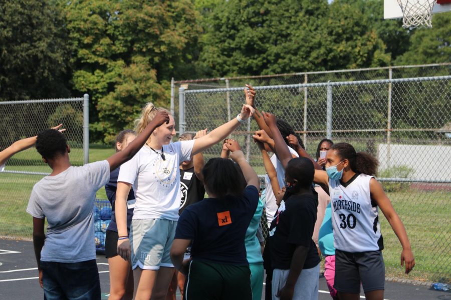 Liza Karlen (left) breaks down her group during Marquette and University of Wisconsin-Milwaukee womens basketball clinic Sept. 11 at Washington Park. 