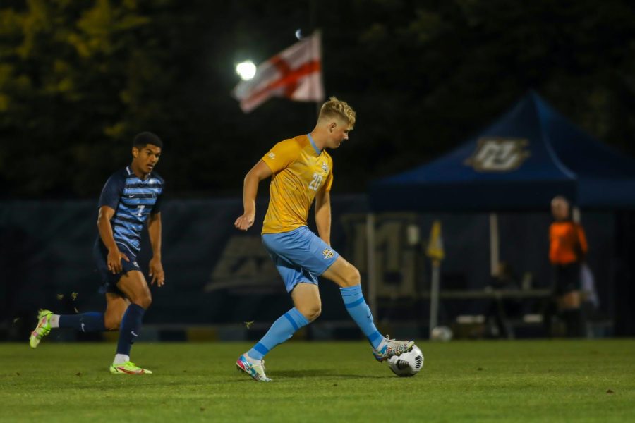 Jonas Moen (20) attempts to make a pass in Marquette mens soccers 1-0 loss to Villanova Sept. 18. (Photo courtesy of Marquette Athletics.)