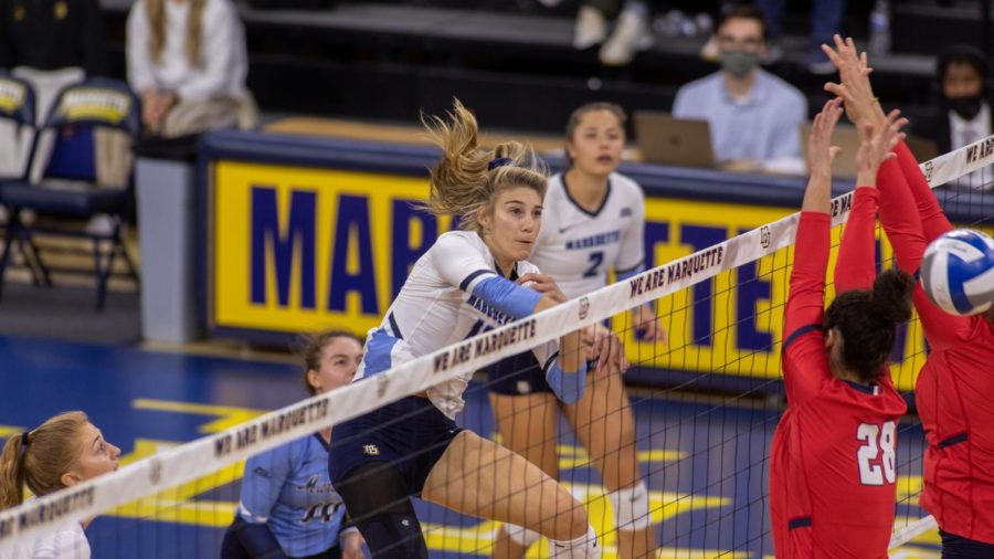 Graduate+student+Savannah+Rennie+finishes+off+a+kill+in+Marquettes+3-0+win+over+St.+Johns+Oct.+15.+%28Photo+courtesy+of+Marquette+Athletics.%29