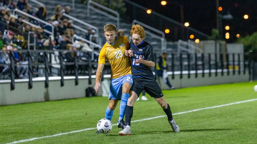 Josh Hewitt (29) takes on a DePaul defender in Marquettes 1-0 win Oct. 16. (Photo courtesy of Marquette Athletics.)