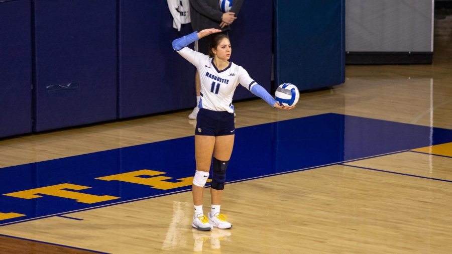 Jadyn Garrison gets ready to serve the ball in Marquettes 3-2 win over DePaul Oct. 20. (Photo courtesy of Marquette Athletics.)