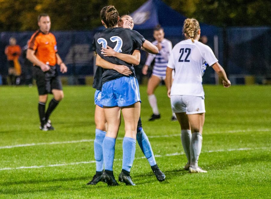 Elsi Twombly (22) celebrates with a teammate after Twomblys goal in Marquettes 2-1 win over DePaul Oct. 28. 
