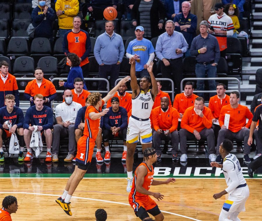 Redshirt first-year forward Justin Lewis takes a 3-pointer in Marquette mens basketballs 67-66 win over No. 10 Illinois Nov. 15. 