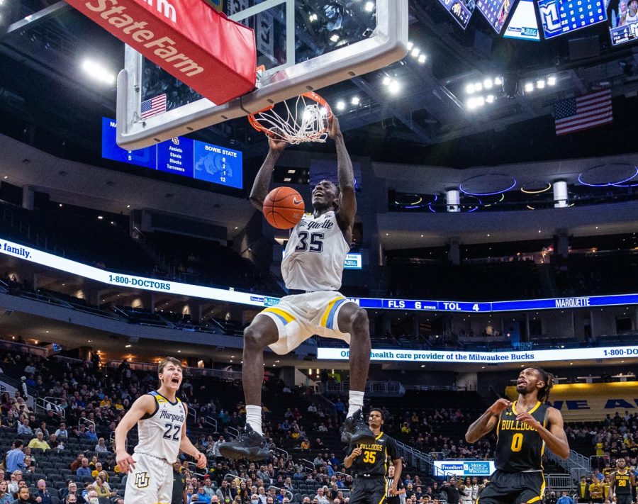 Kur Kuath (35) finishes a dunk in Marquette mens basketballs 98-40 exhibition win over Bowie State Nov. 4. 