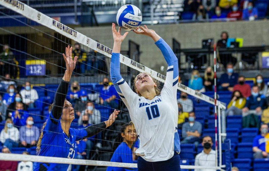 Graduate student Taylor Wolf (10) sets the ball while Creighton’s Naomi Hickman (21) watches. The Golden Eagles lost to the Bluejays 3-1 on October 29, 2021 at the Al McGuire Center (COLLIN NAWROCKI/Marquette Wire)