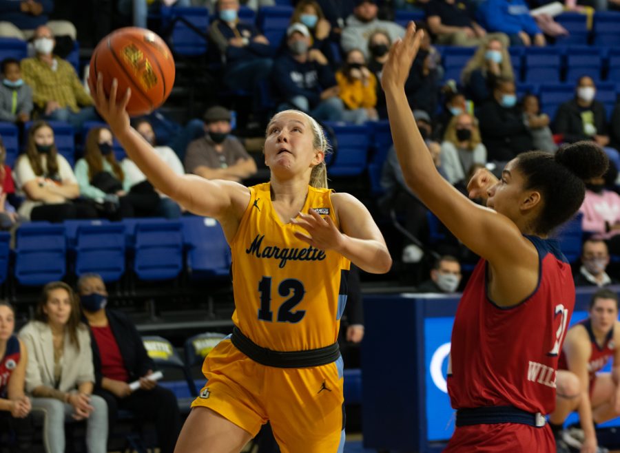 Graduate+student+guard+Karissa+McLaughlin+%2812%29+goes+up+for+a+layup+in+Marquette+womens+basketballs+90-58+win+over+NJIT+Nov.+12.+