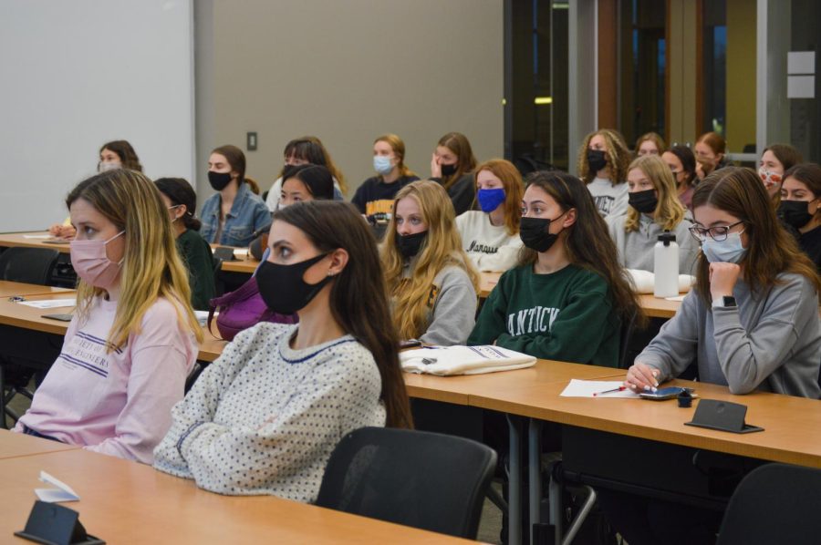 Members of the Society of Women Engineers student organization watch a video during a club meeting on October 5, 2021.