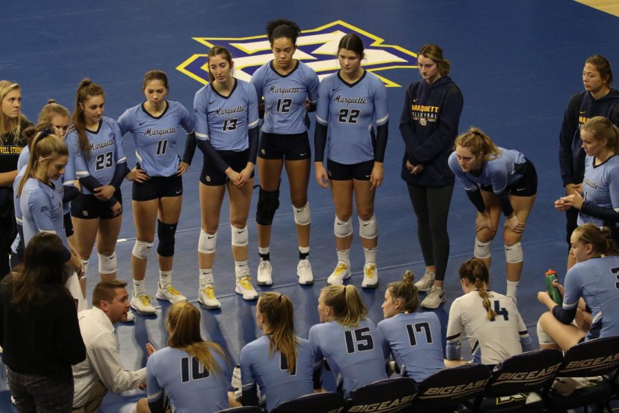 Marquette volleyball head coach Ryan Theis talks to his team during a timeout in the 2021 BIG EAST Volleyball Championship game Nov. 27. 