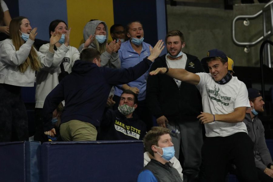 Members of the Marquette womens soccer, mens lacrosse and track and field celebrate during Marquette volleyballs 0-3 loss to Creighton in the BIG EAST Championship game Nov. 27.