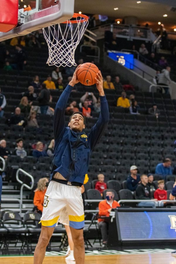 First-year forward Keeyan Itejere goes up for a layup in warmups prior to Marquette mens basketballs 67-66 win over No. 10 Illinois Nov. 15. 