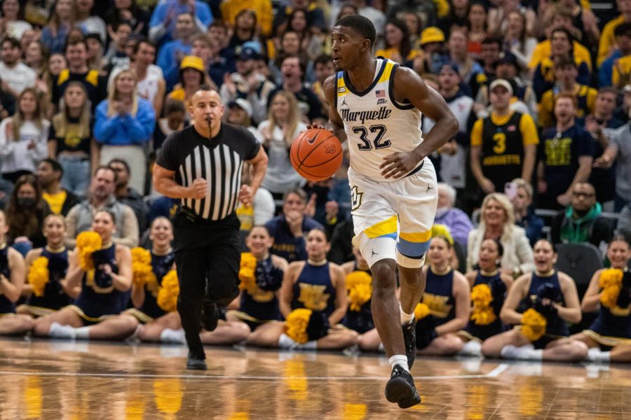 Graduate student Darryl Morsell brings the ball up court in Marquette mens basketballs 67-66 win over No. 10 Illinois Nov. 15. 