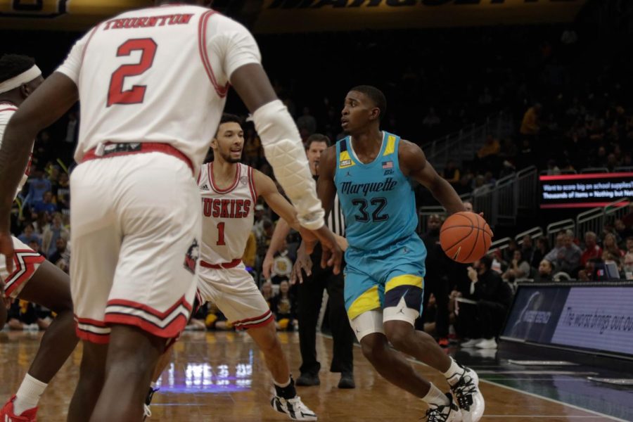 Graduate student Darryl Morsell looks across court as he dribbles the ball in Marquette men's basketball's 80-66 win over Northern Illinois Nov. 27. 