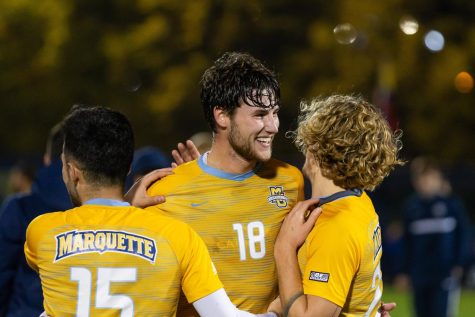 Christian Marquez (left), AJ Franklin (center) and Zak Wegner (right) celebrate after Marquette men’s soccer ‘s 1-0 win over No. 1 Georgetown Saturday night at Valley Fields on senior night. (Photo courtesy of Marquette Athletics.)