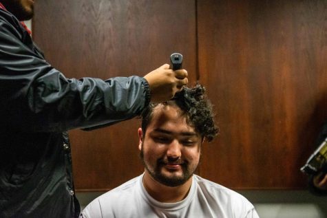 Carlos Nunez has his head shaved during the Bald a Beta event.