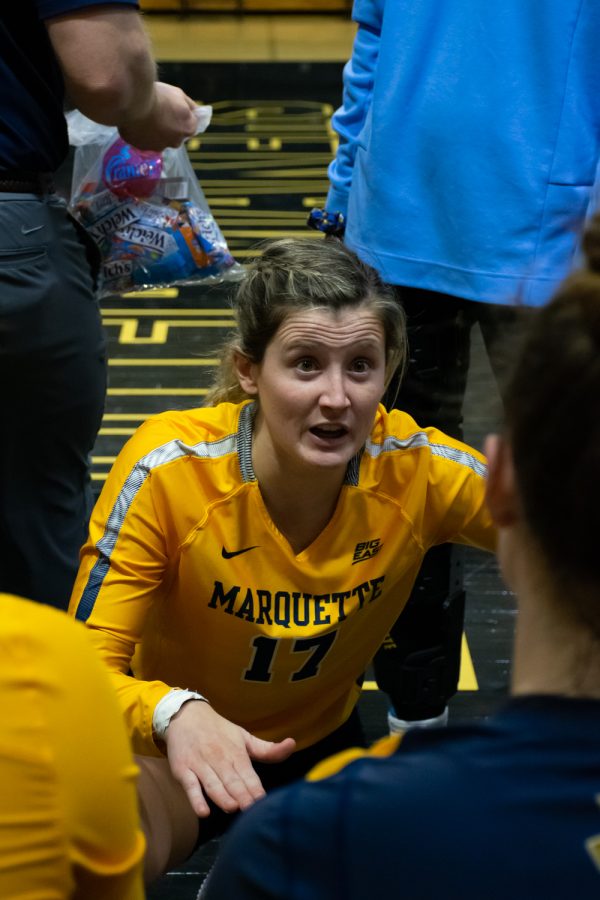 Redshirt junior defensive specialist Katie Schoessow (17) talking during a huddle in Marquettes 1-3 loss to Dayton in the 1st Round of the NCAA Tournament Dec. 2. 