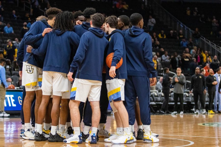 Marquette mens basketball huddles prior to its 67-66 win over then-No. 10 Illinois Nov. 15. 
