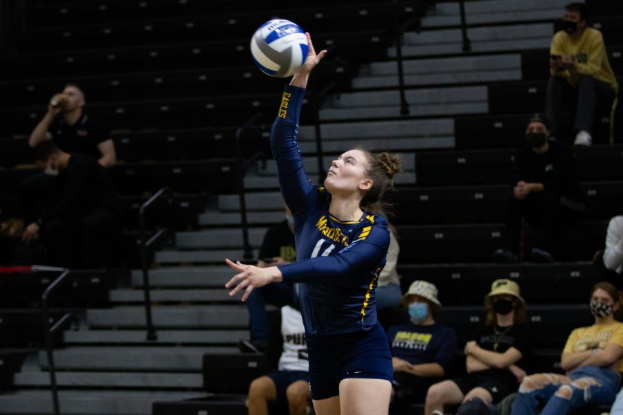 Redshirt sophomore defensive specialist Carly Skrabak (14) attempts a serve in Marquettes 1-3 loss to Dayton in the First Round of the NCAA Tournament Dec. 2. 