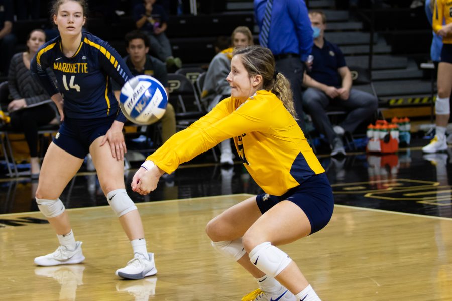 Redshirt junior defensive specialist Katie Schoessow (17) goes for a dig in Marquette volleyballs 1-3 loss to Dayton in the First Round of the NCAA Tournament Dec. 2. 