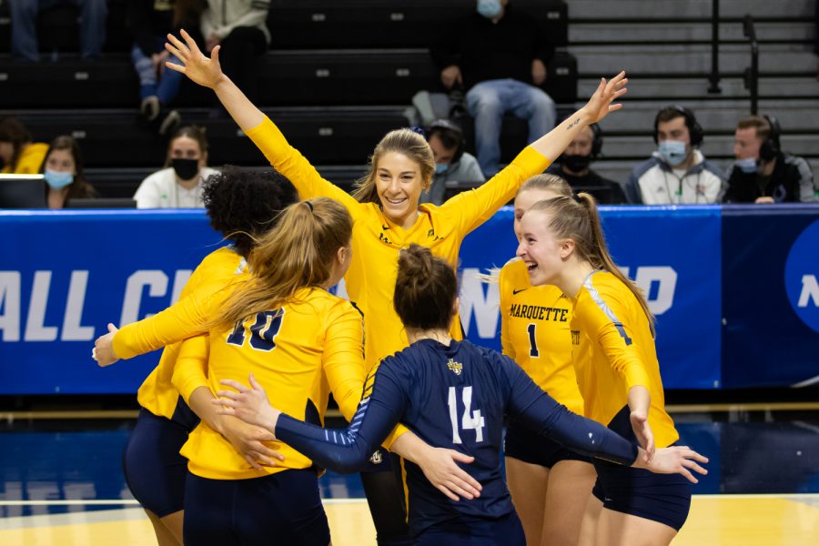 Marquette volleyball celebrates after a point in its 1-3 loss to Dayton in the First Round of the NCAA Tournament Dec. 2. 