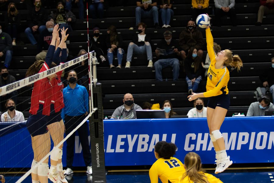 Graduate student Taylor Wolf (10) attempts a kill in Marquette volleyballs 1-3 loss to Dayton in the First Round of the NCAA Tournament Dec. 2. 