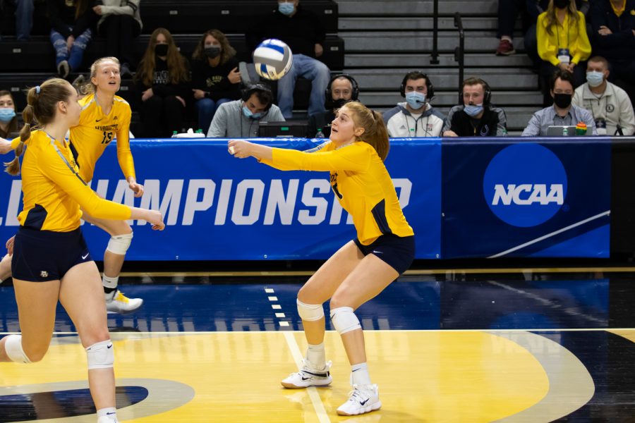 Graduate student Taylor Wolf (10) attempts to set a pass in Marquette volleyballs 1-3 loss to Dayton in the First Round of the NCAA Tournament Dec. 2. 