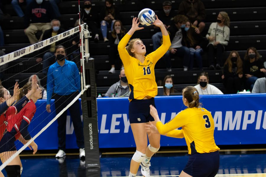 Graduate student Taylor Wolf (10) sets the ball in Marquette volleyballs 1-3 loss to Dayton in the First Round of the NCAA Tournament Dec. 2. 