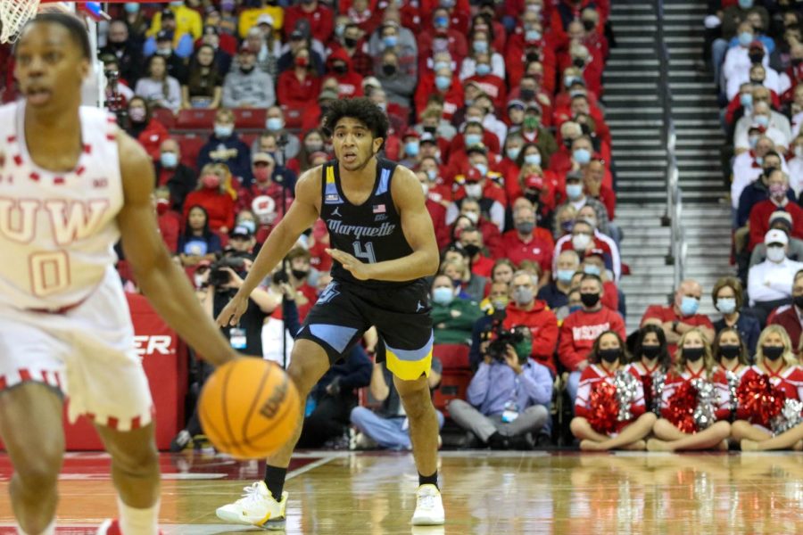 First-year guard Stevie Mitchell (4) in Marquette mens basketballs 89-76 loss to No. 23 Wisconsin Dec. 4. 