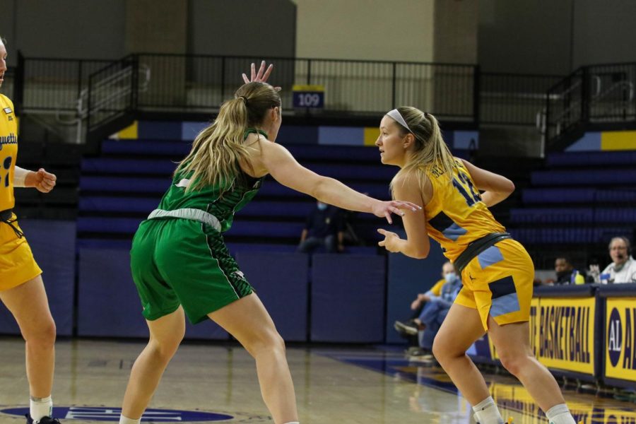 Graduate student guard Karissa McLaughlin (12) moves the ball in Marquette womens basketballs 89-65 win over North Dakota Dec. 11. 