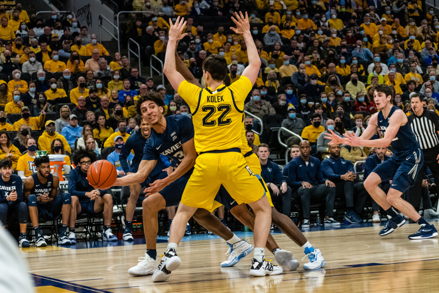 Redshirt first-year guard Tyler Kolek (22) in a defensive stance in Marquette mens basketballs 75-64 win over No. 20 Xavier Jan. 23. 