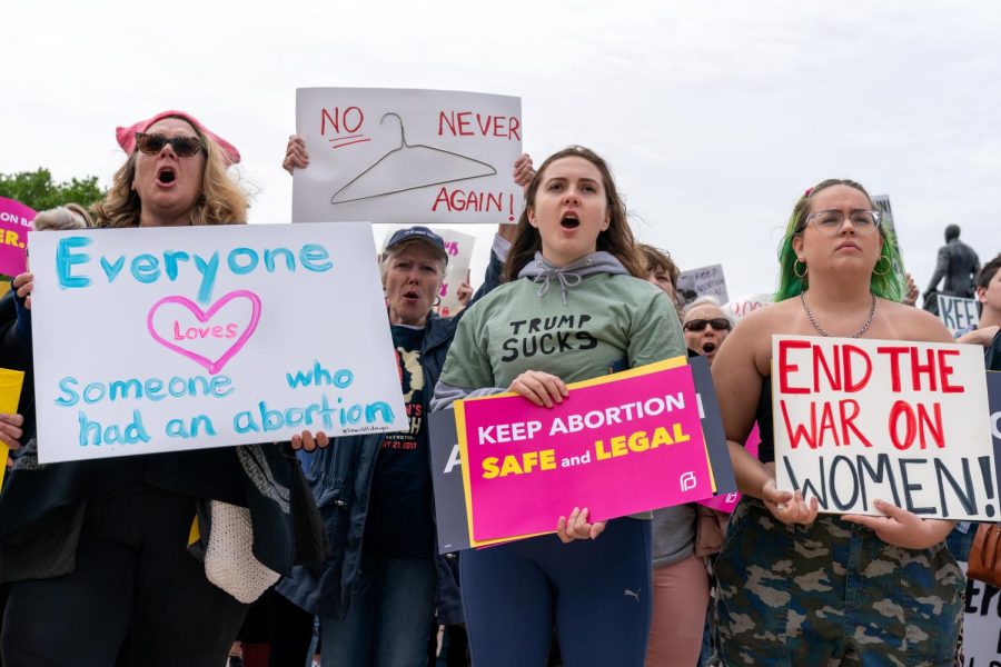 Women hold signs up at a pro-choice rally in St. Paul, Minnesota 2019. Photo via Flickr