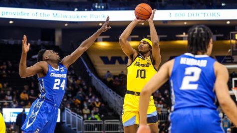 Redshirt first-year forward Justin Lewis attempts a shot in Marquette mens basketballs 75-69 loss to Creighton Jan. 1. (Photo courtesy of Marquette Athletics.)