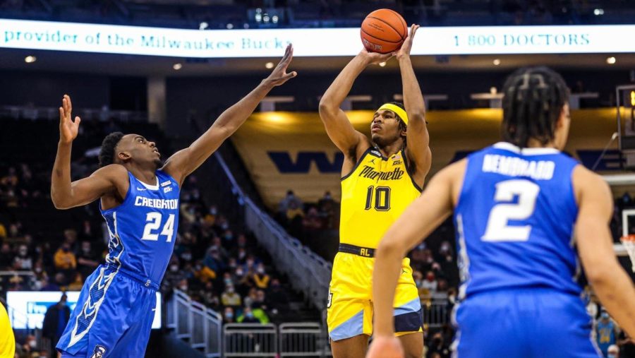 Redshirt first-year forward Justin Lewis attempts a shot in Marquette men's basketball's 75-69 loss to Creighton Jan. 1. (Photo courtesy of Marquette Athletics.)