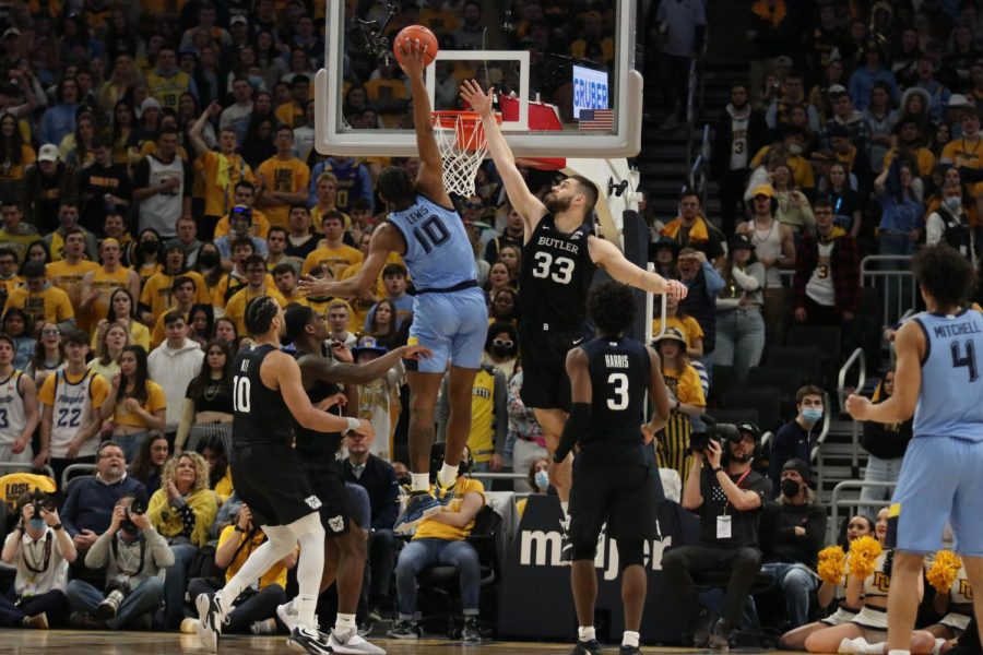 Redshirt first-year forward Justin Lewis (10) goes in for a slam dunk in Marquette mens basketballs 64-56 win over Butler Feb. 26 on National Marquette Day. 