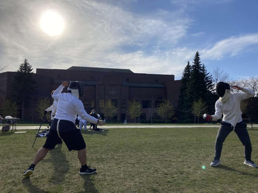Members of the Marquette Fencing Club practicing outside of the Alumni Memorial Union. 
(Photo courtesy of the Marquette Fencing Club.) 