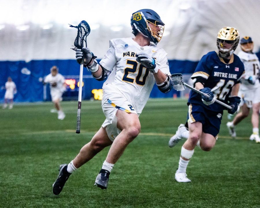 Redshirt+sophomore+face-off+specialist+Cole+Emmanuel+running+with+the+ball+in+Marquettes+18-8+loss+to+Notre+Dame+April+12.+