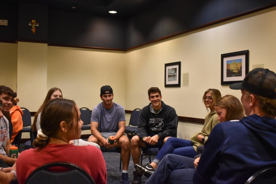 Members of the Marquette Fellowship of Christian Athletes meet during a meeting Sept. 25. 
