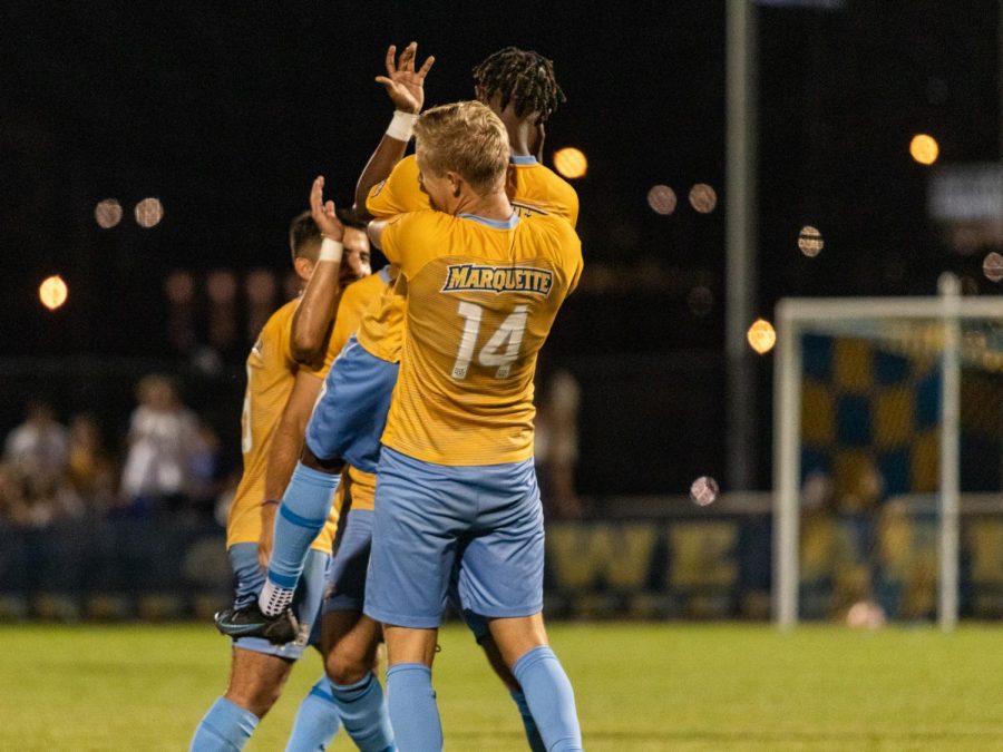 Marquette+mens+soccer+celebrates+after+a+goal+in+its+3-0+win+over+the+University+of+Michigan+Sept.+9+at+Valley+Fields.+