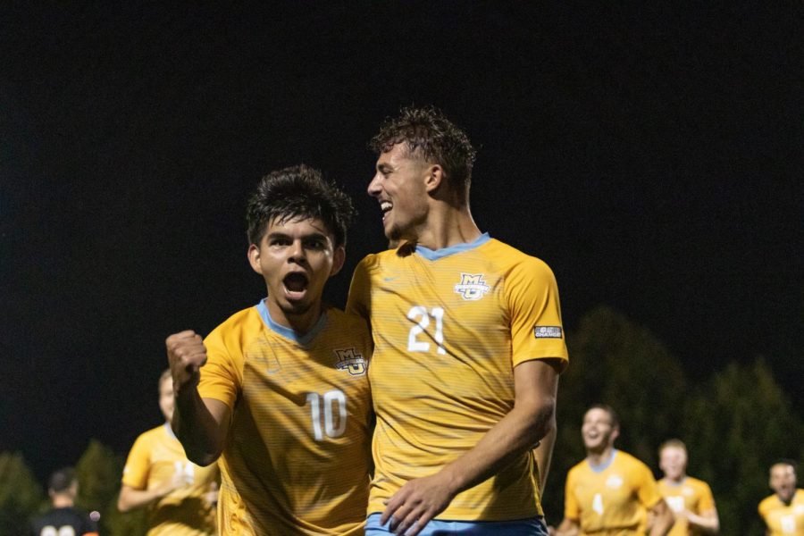 Beto Soto (11) and Alex Mirsberger (21) celebrate in Marquette mens soccers 5-2 win in the Milwaukee Cup over the University of Wisconsin-Milwaukee Sept. 20. 