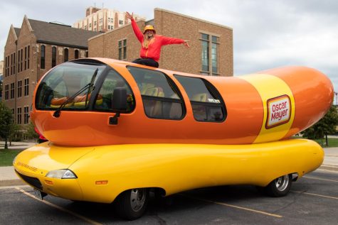 Kaitlyn Bross, a graduate of Marquette University, sits atop the Oscar Mayer Wienermobile September 23. She is one of 12 hotdoggers in the United States.