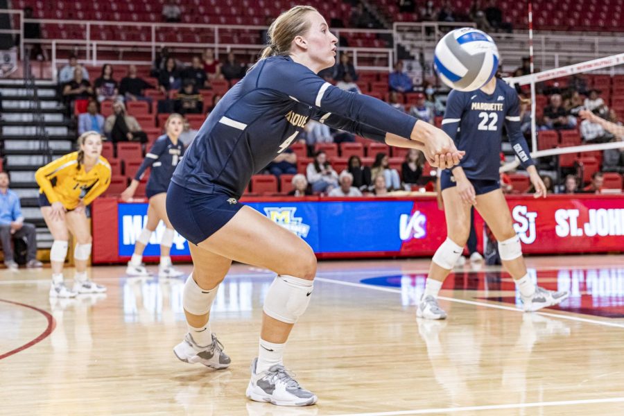 Jenna Reitsma finished with 13 digs and 10 kills in No. 18 Marquette volleyballs 3-0 win at St. Johns Oct. 7. (Photo courtesy of Marquette Athletics.)
