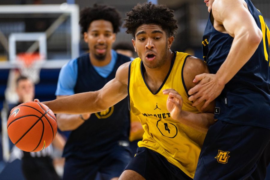 Mens basketball sophomore guard Stevie Mitchell (4) led the Gold team with 16 points in the Blue and Gold scrimmage at the Al McGuire Center Oct. 8. 