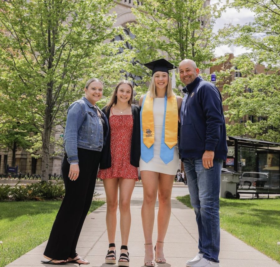 Jordan King (center right) with her family outside the Al McGuire Center after 2022 May Commencement. 
(Photo courtesy of Jordan King.) 