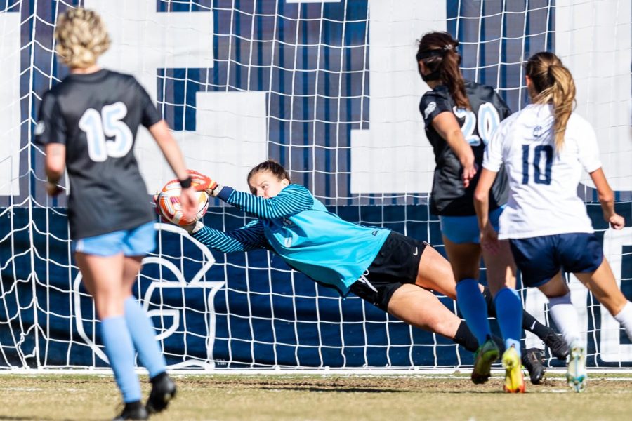 Sophomore goalkeeper Chloe Olson makes a save in Marquette womens soccers 1-0 loss to No. 16 Georgetown Oct. 20. (Photo courtesy of Marquette Athletics.)