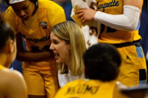 Head coach Megan Duffy talks in a huddle during Marquette womens basketballs win over Fairleigh Dickinson Nov. 7 at the Al McGuire Center. (Photo courtesy of Marquette Athletics.)
