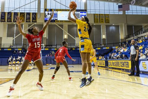 Sophomore forward Makiyah Williams (24) takes a shot in Marquette womens basketballs win over Saint Francis Nov. 27. (Photo courtesy of Marquette Athletics.)