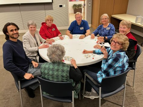 Hosting a domino game activity, Antonio Martins, spends time with the residents. 