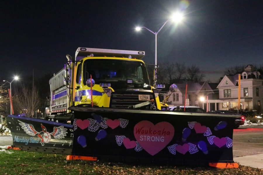 A snowplow parked near Cutler Park where the one year remembrance ceremony for the Waukesha parade victims was held depicts the message “Waukesha strong.” Eleven art students from Waukesha South High School painted the snowplow together as a symbol of unity for the community.